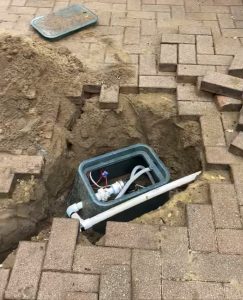 Bore drilled in driveway under paving